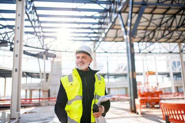 man-engineer-with-walkie-talkie-standing-on-constr-small.jpg